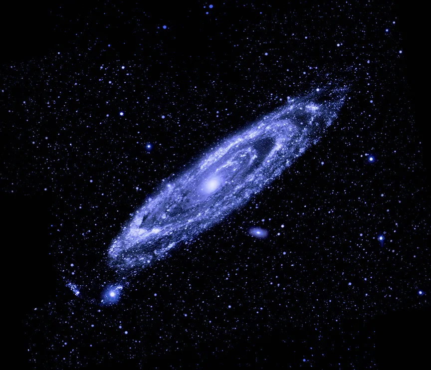 Andromeda Galaxy in ultraviolet — GALEX FUV imaging of M31 highlights the UV-bright OB associations tracing the spiral arms and star-formation ring, contrasting with the UV-faint old stellar bulge at the galaxy's centre.