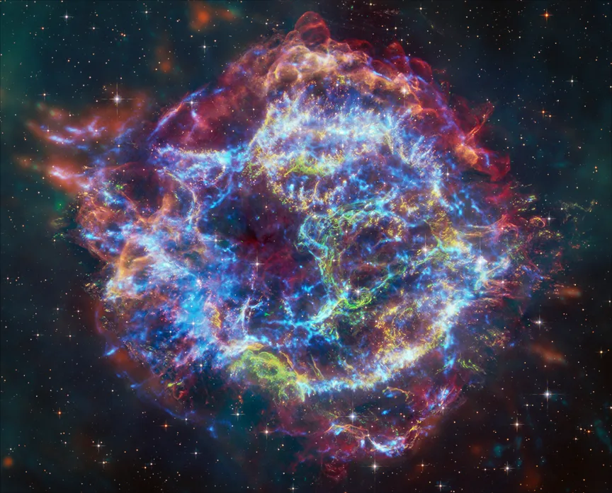 Cassiopeia A in multi — Four-wavelength composite shows how radio synchrotron, IR light echoes, optical ejecta knots, and X-ray iron arcs all map different physical processes in the same 10-light-year shell.