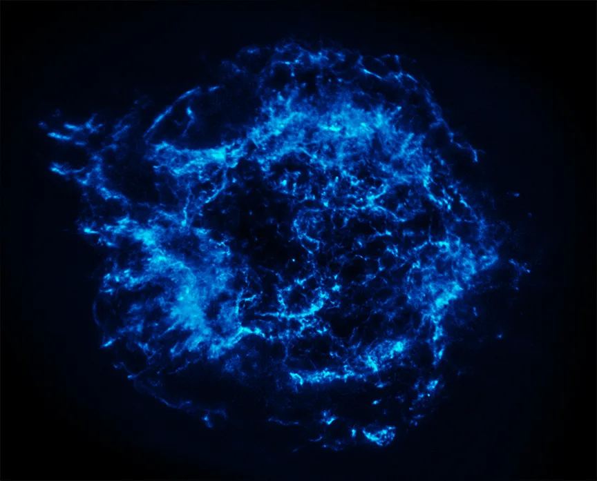 Cassiopeia A in xray — Chandra reveals iron-rich ejecta arcs, the reverse shock bubble, and the compact central object; colour-coded maps distinguish silicon, sulphur, calcium, and iron.