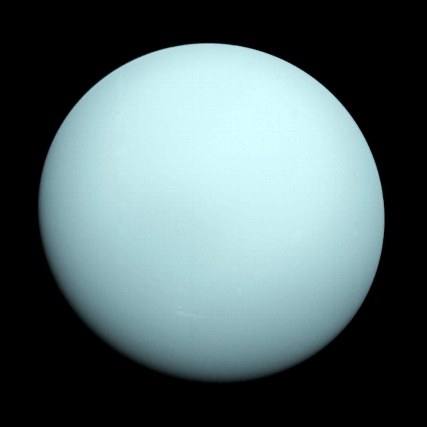 The pale blue-green globe of Uranus, imaged by NASA's Voyager 2 in January 1986 (NASA/JPL-Caltech)