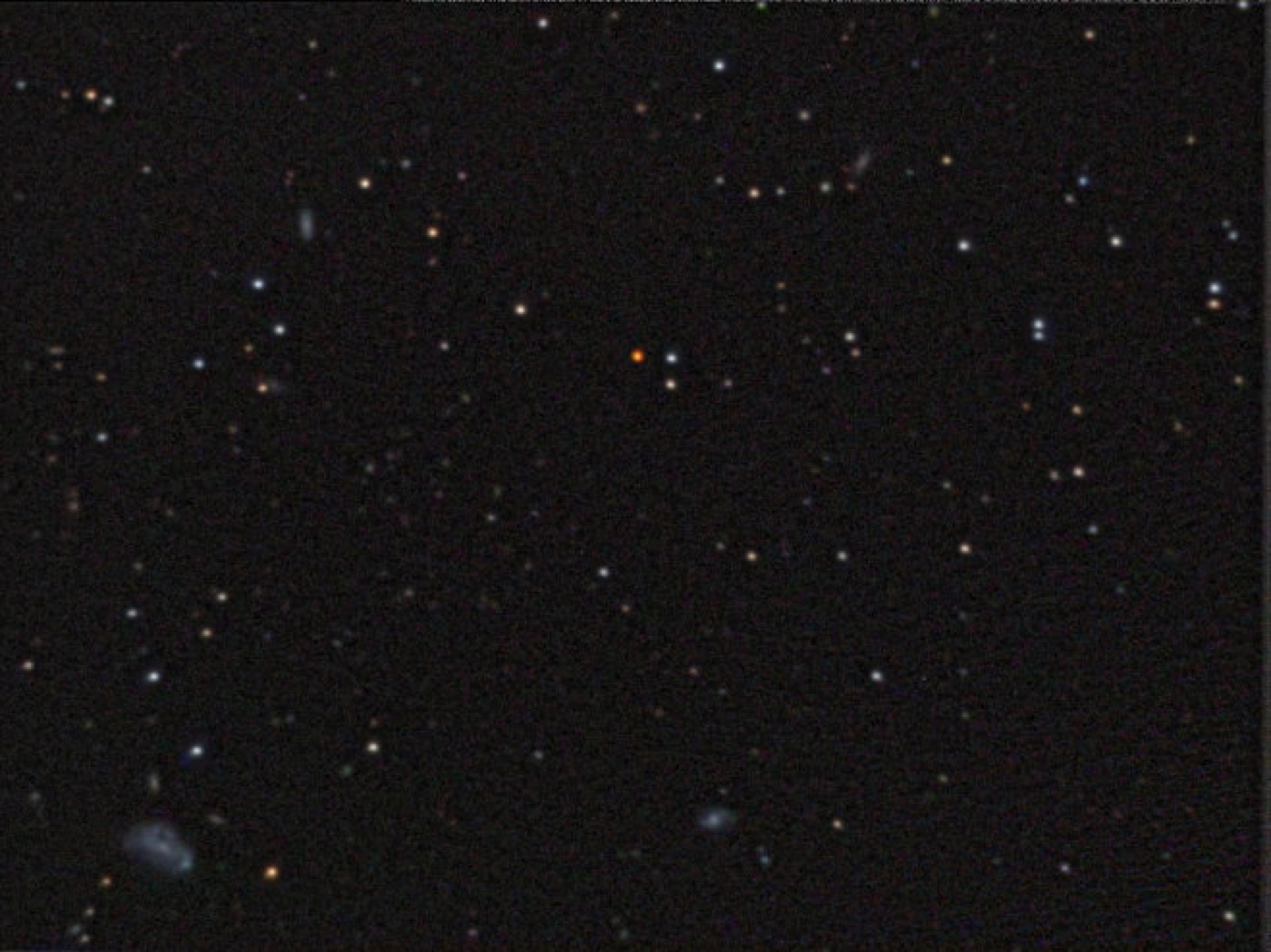 Astrophotograph showing Wolf 359 as the orange-hued point of light just above centre, taken with a 10-inch SCT telescope in 2009